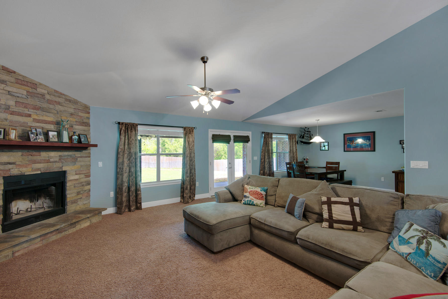 2383 Crescent Road Navarre, FL 32566 - Photo 9 of 48 a living room with furniture and a fireplace