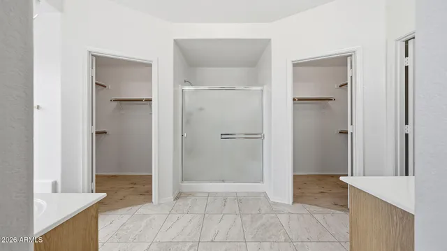 a bathroom with a sink vanity and a mirror