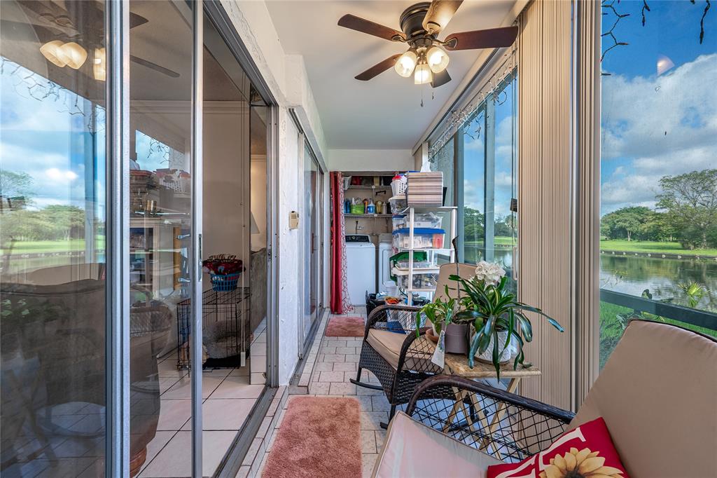 3601 Inverrary Drive, Unit 107 Lauderhill, FL 33319 - Photo 16 of 25 a livingroom with furniture and a potted plant