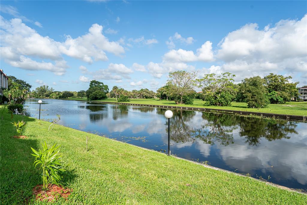 3601 Inverrary Drive, Unit 107 Lauderhill, FL 33319 - Photo 18 of 25 a view of a lake with a city