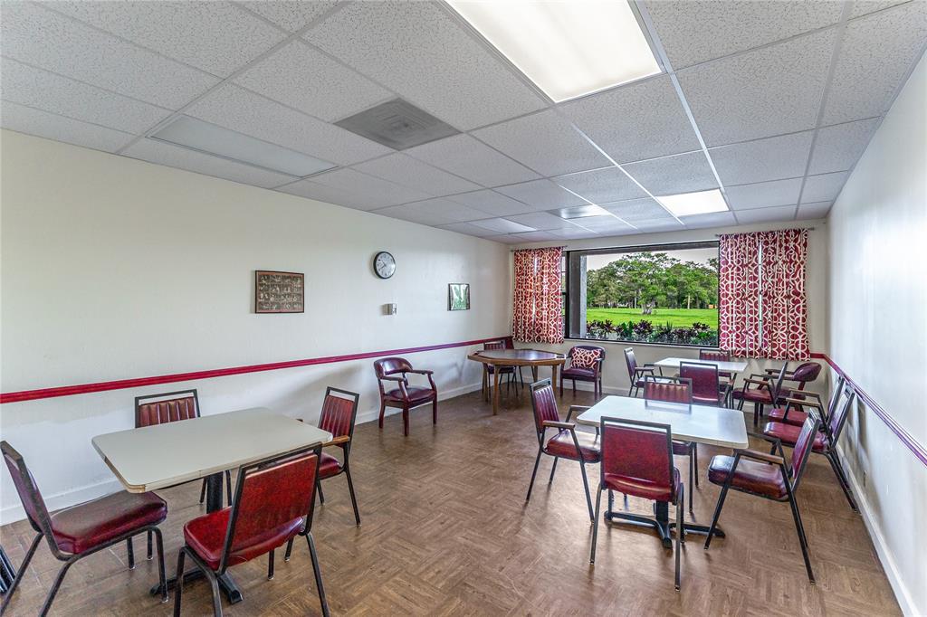 3601 Inverrary Drive, Unit 107 Lauderhill, FL 33319 - Photo 21 of 25 a view of a dining room with furniture window and outside view