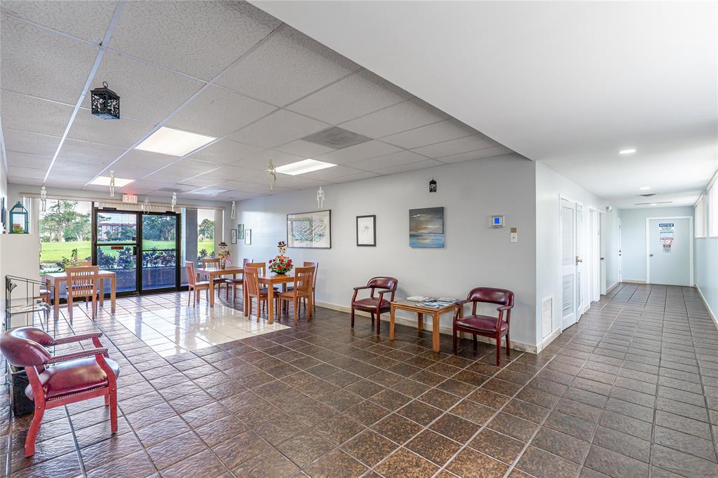 3601 Inverrary Drive, Unit 107 Lauderhill, FL 33319 - Photo 24 of 25 a view of a livingroom with furniture and dining table