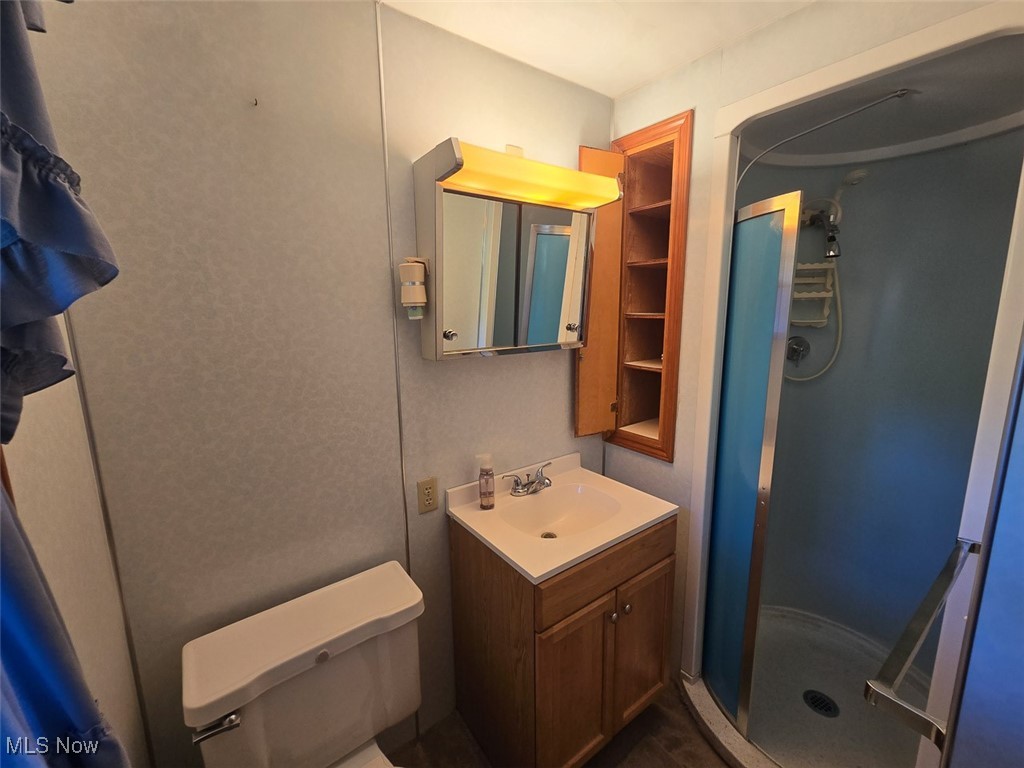 715 Minerva Road Magnolia, OH 44643 - Photo 19 of 26 Bathroom with vanity and a stall shower