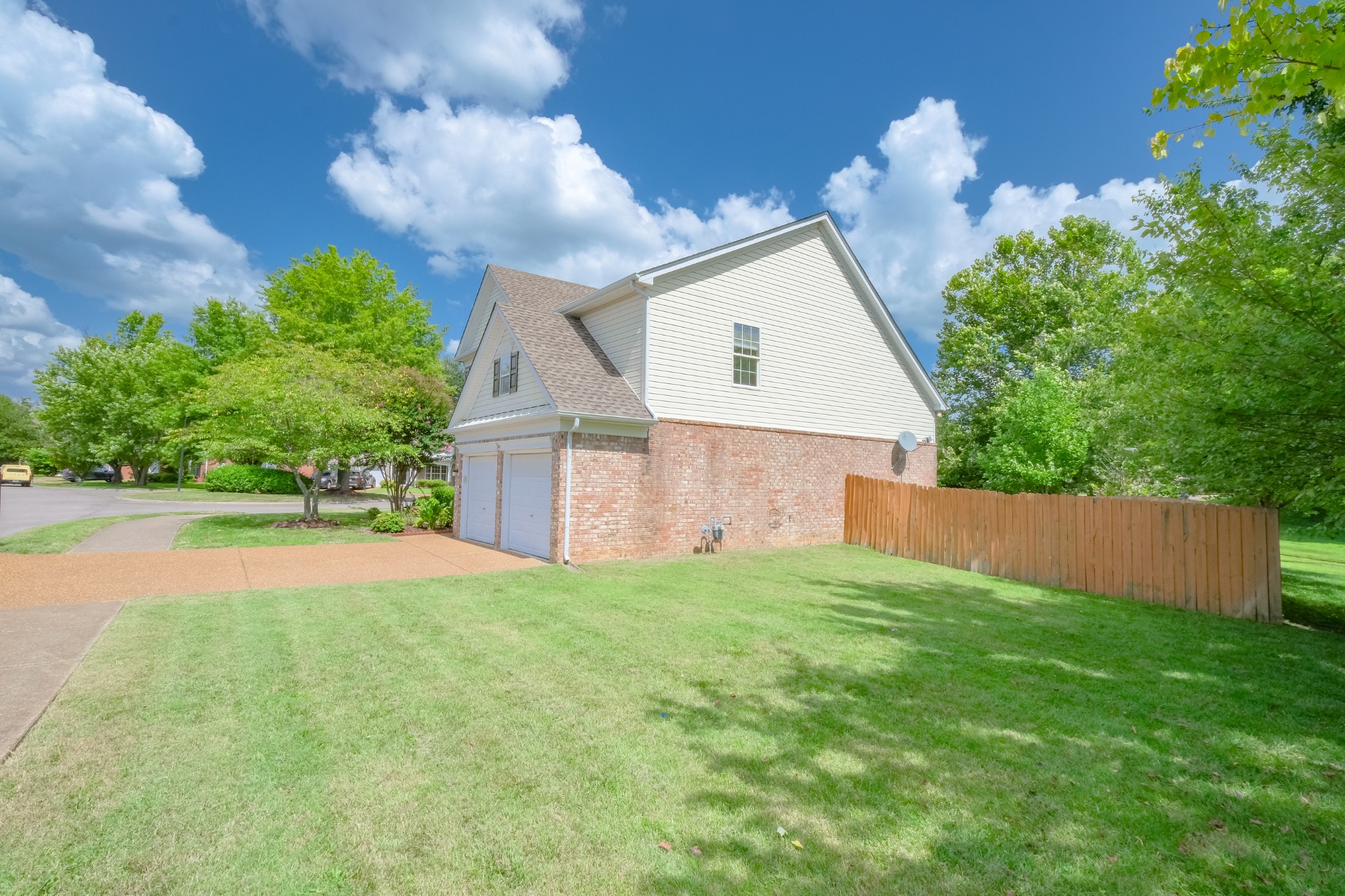 130 Stanwick Drive Franklin, TN 37067 - Photo 2 of 37 a view of a house with a yard and a garage