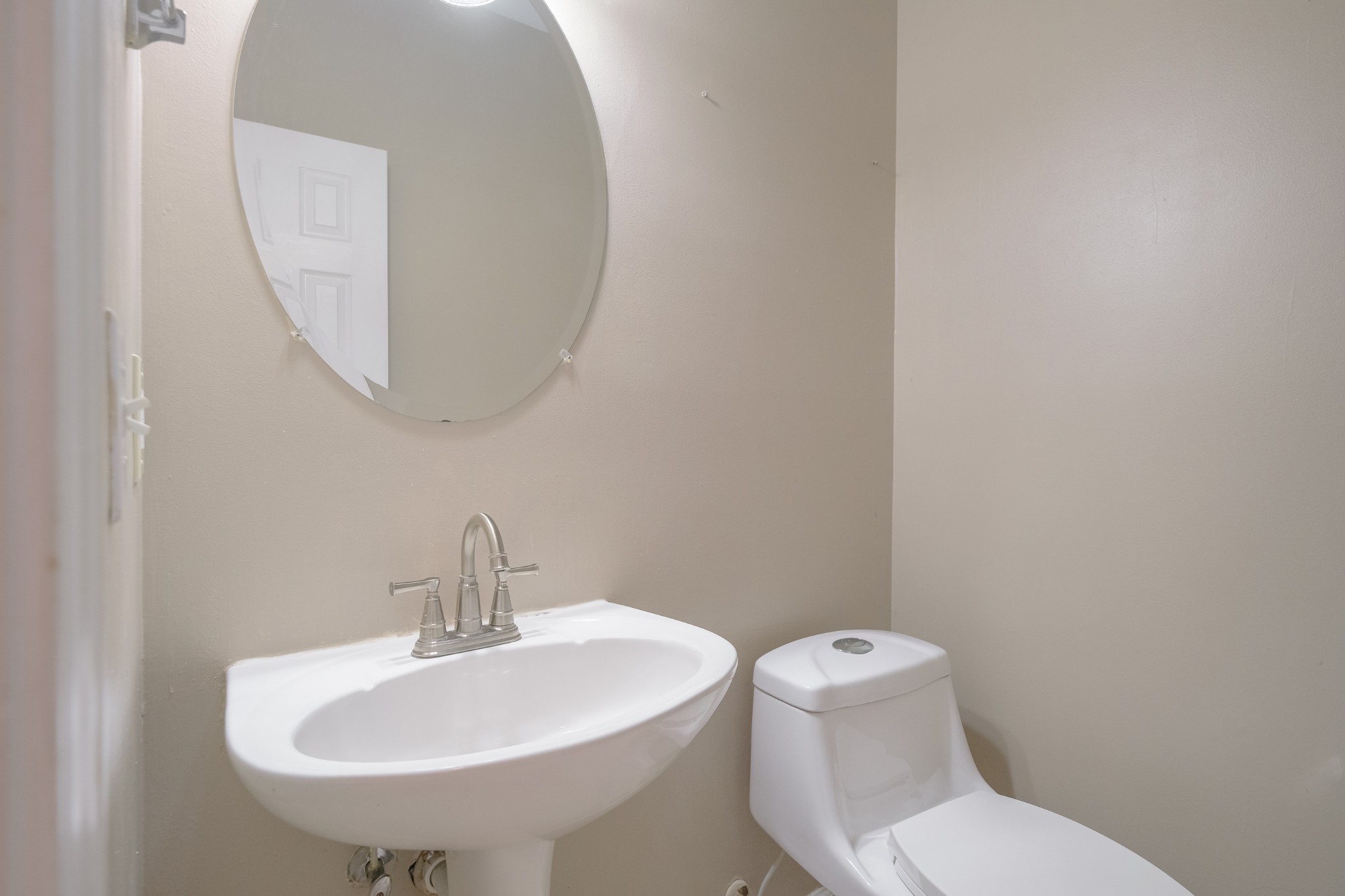 130 Stanwick Drive Franklin, TN 37067 - Photo 12 of 37 a white toilet sitting next to a bathroom sink