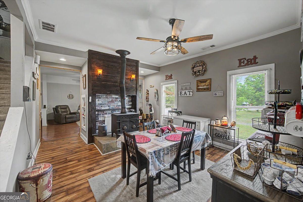 483 Coal Road Northwest Resaca, GA 30735 - Photo 16 of 56 a living room with furniture a fireplace and a window