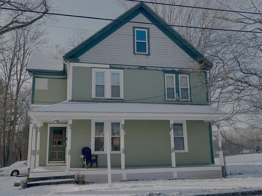 204 Elm Street Amesbury, MA 01913 - Photo 2 of 28 a view of a house with a small garden