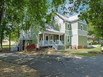 204 Elm Street Amesbury, MA 01913 - Photo 22 of 28 a front view of house with yard