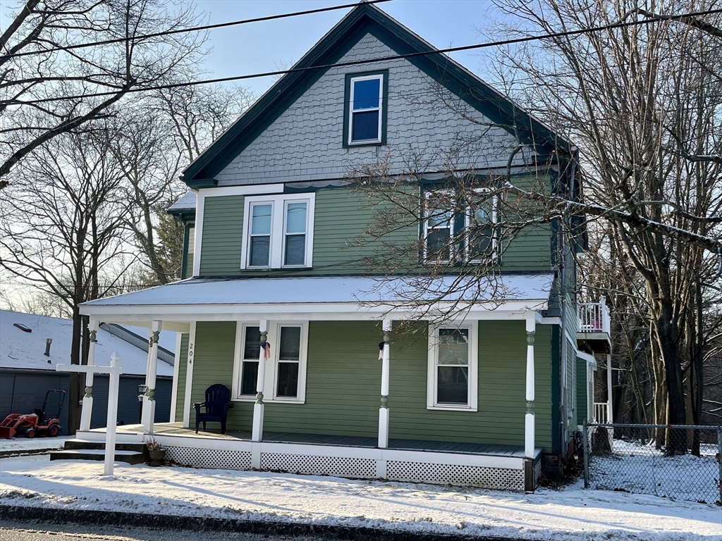 204 Elm Street Amesbury, MA 01913 - Photo 25 of 28 a front view of a house with a yard