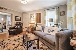 204 Elm Street Amesbury, MA 01913 - Photo 6 of 28 a living room with furniture window and a table
