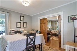 204 Elm Street Amesbury, MA 01913 - Photo 7 of 28 a bedroom with a bed a table and chair