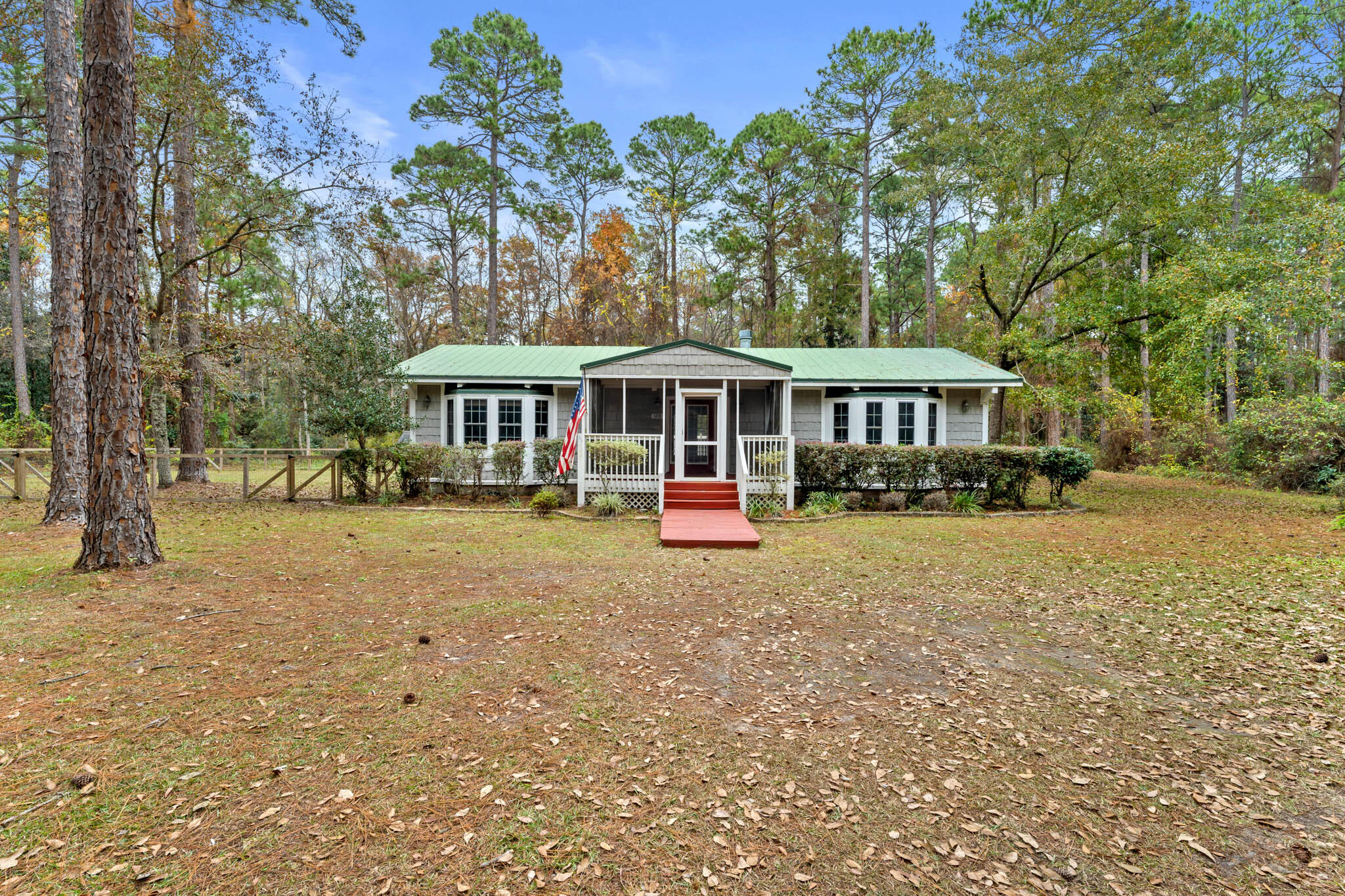 108 Osprey Lane Santa Rosa Beach, FL 32459 - Photo 2 of 40 a front view of a building with a garden