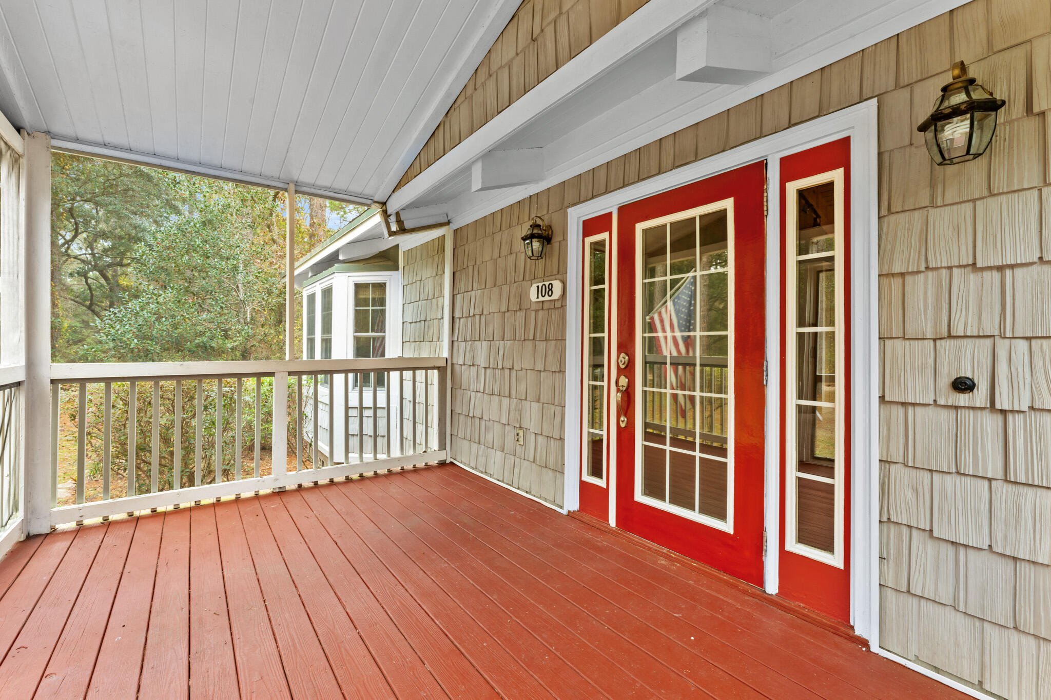 108 Osprey Lane Santa Rosa Beach, FL 32459 - Photo 26 of 40 a view of a brick house with large windows and wooden floor