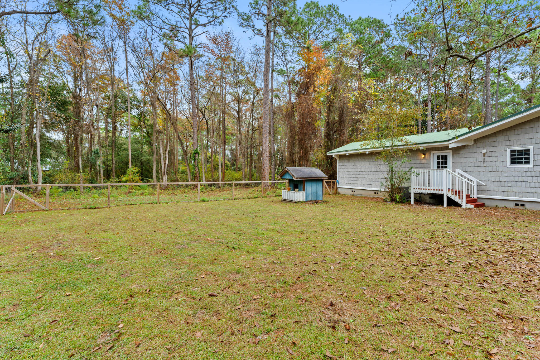 108 Osprey Lane Santa Rosa Beach, FL 32459 - Photo 32 of 40 a view of a house with backyard and trees