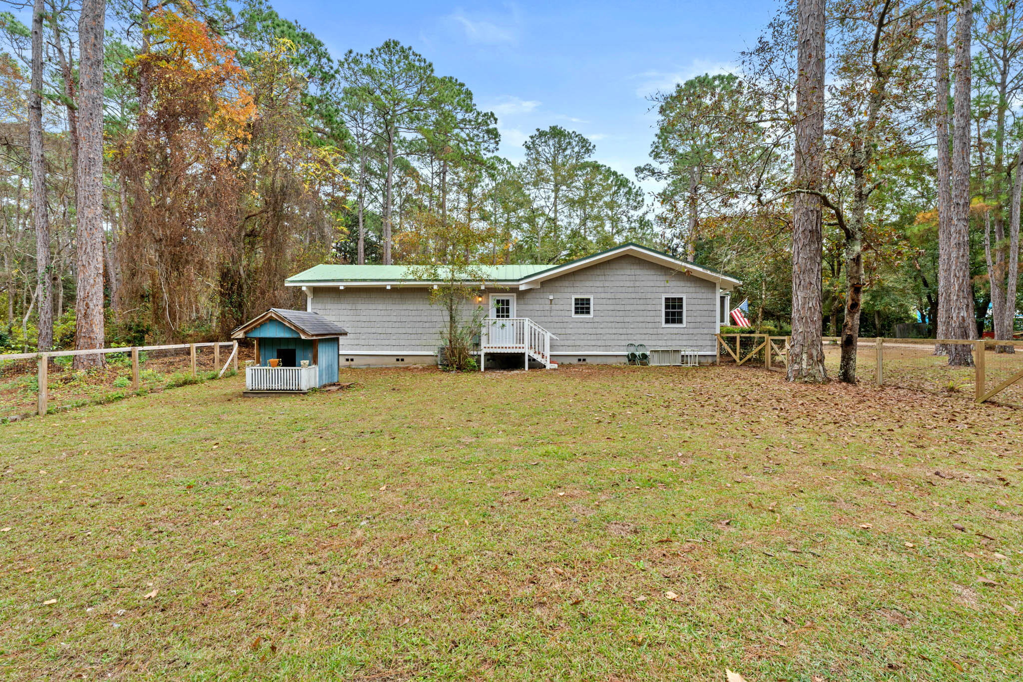 108 Osprey Lane Santa Rosa Beach, FL 32459 - Photo 33 of 40 a view of a house with a yard and trees