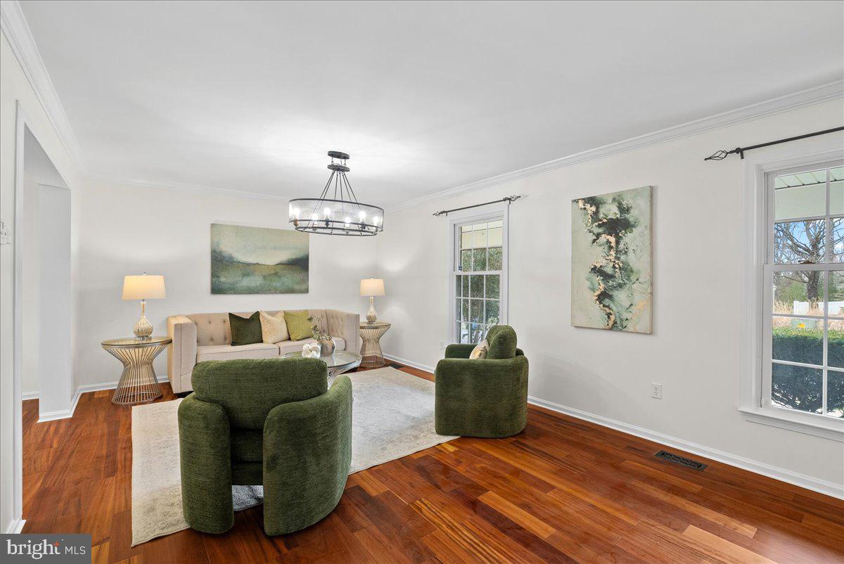 7596 Ruxton Drive Springfield, VA 22153 - Photo 11 of 40 a living room with furniture a window and a flat screen tv