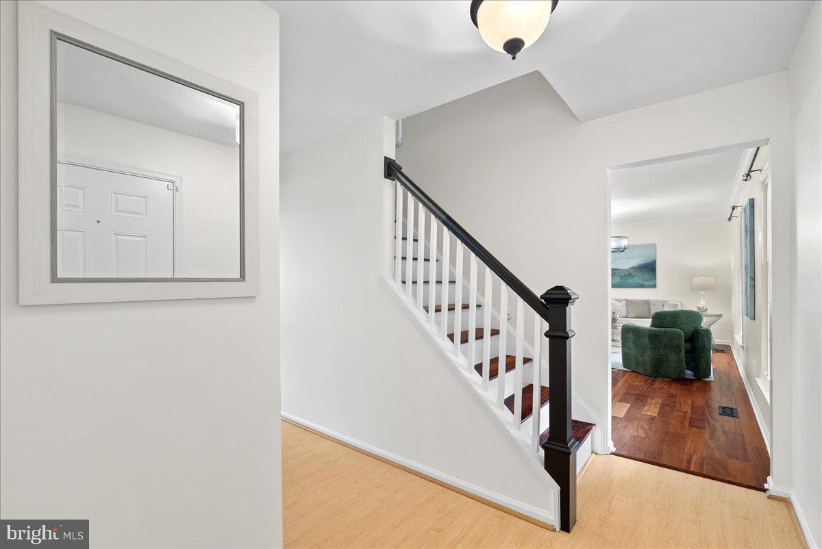 7596 Ruxton Drive Springfield, VA 22153 - Photo 2 of 40 a view of entryway and hall with wooden floor