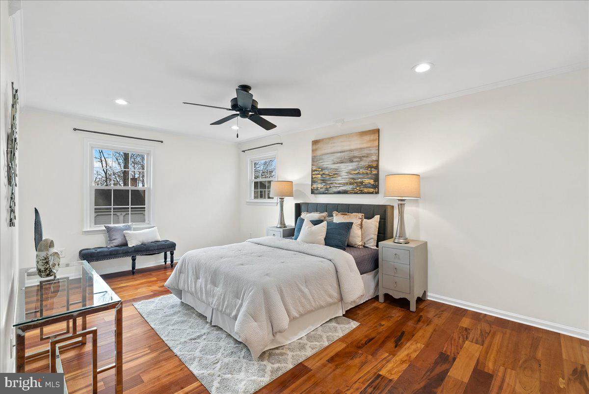 7596 Ruxton Drive Springfield, VA 22153 - Photo 22 of 40 a bedroom with a bed and a table in it