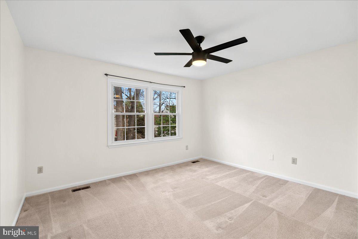 7596 Ruxton Drive Springfield, VA 22153 - Photo 30 of 40 a view of an empty room with a window