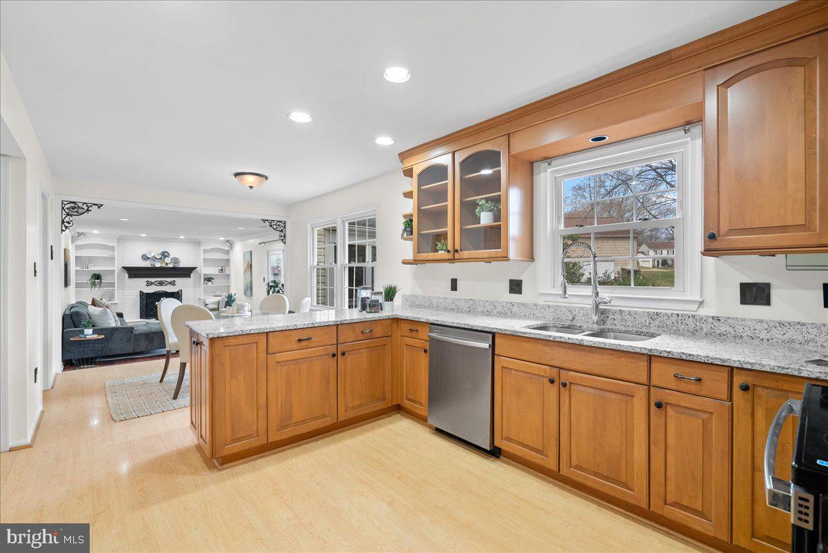 7596 Ruxton Drive Springfield, VA 22153 - Photo 4 of 40 a large kitchen with stainless steel appliances granite countertop a sink and cabinets