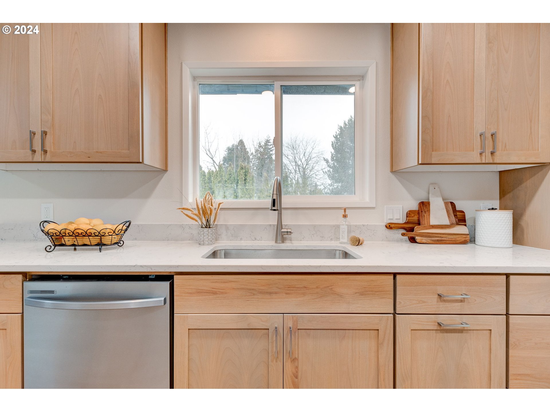 8815 Southwest 69th Avenue Portland, OR 97223 - Photo 13 of 36 a kitchen with a sink and a window