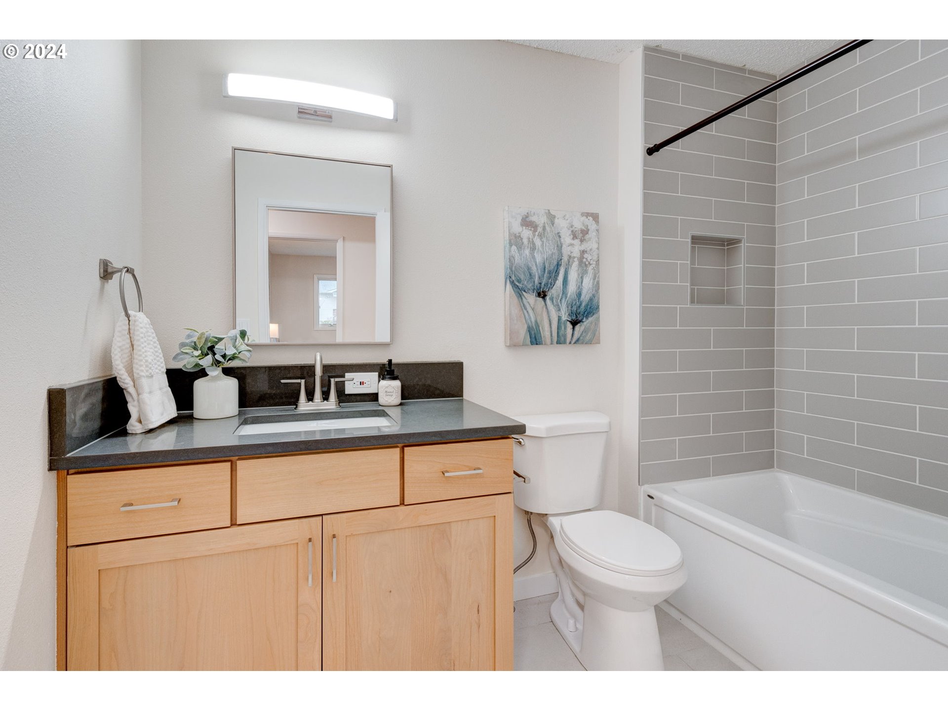 8815 Southwest 69th Avenue Portland, OR 97223 - Photo 16 of 36 a bathroom with a sink a toilet and shower