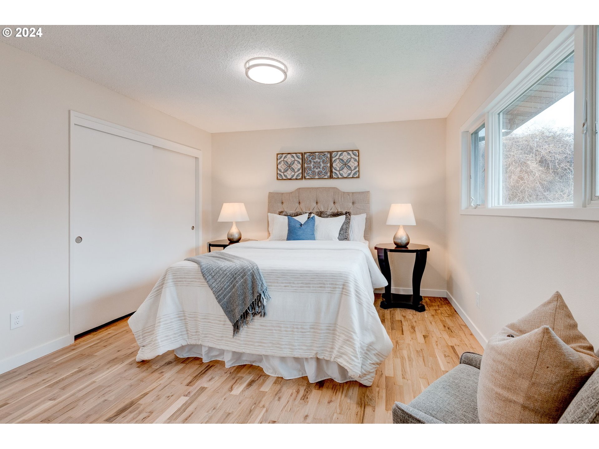 8815 Southwest 69th Avenue Portland, OR 97223 - Photo 20 of 36 a bedroom with a bed and wooden floor