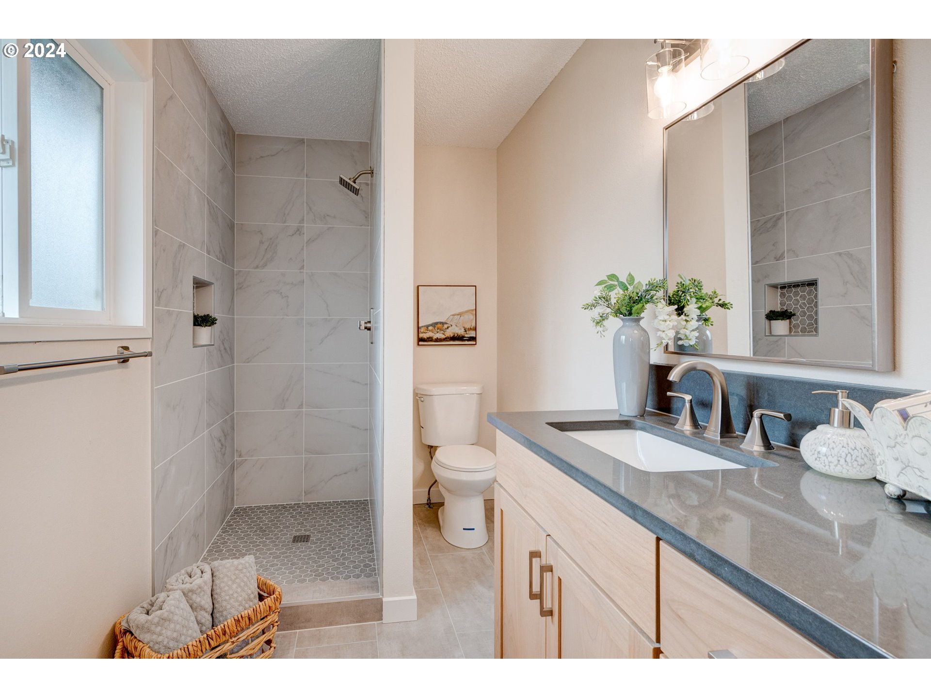 8815 Southwest 69th Avenue Portland, OR 97223 - Photo 22 of 36 a bathroom with a granite countertop sink a toilet and shower