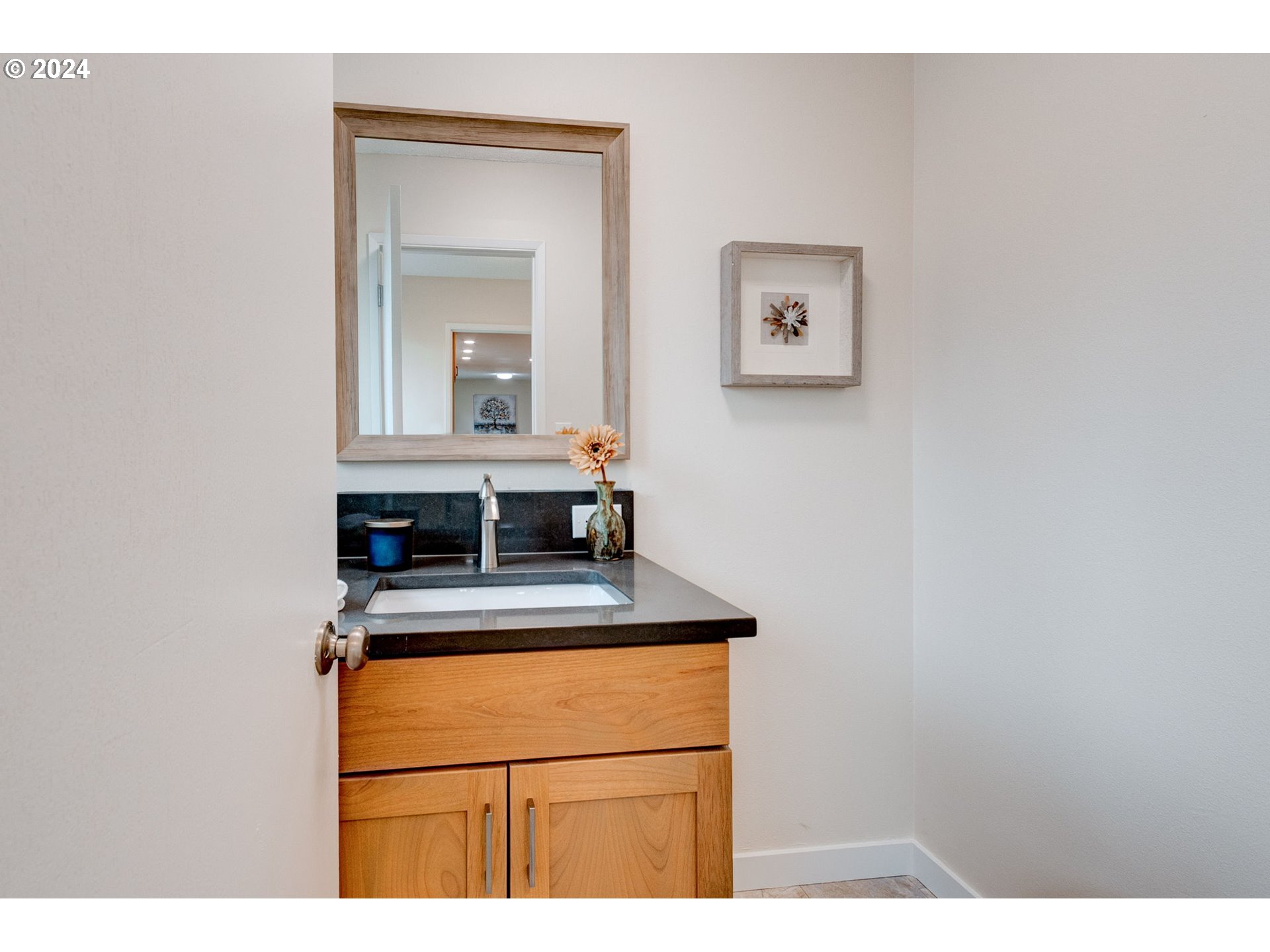 8815 Southwest 69th Avenue Portland, OR 97223 - Photo 25 of 36 a kitchen view with a sink and a mirror