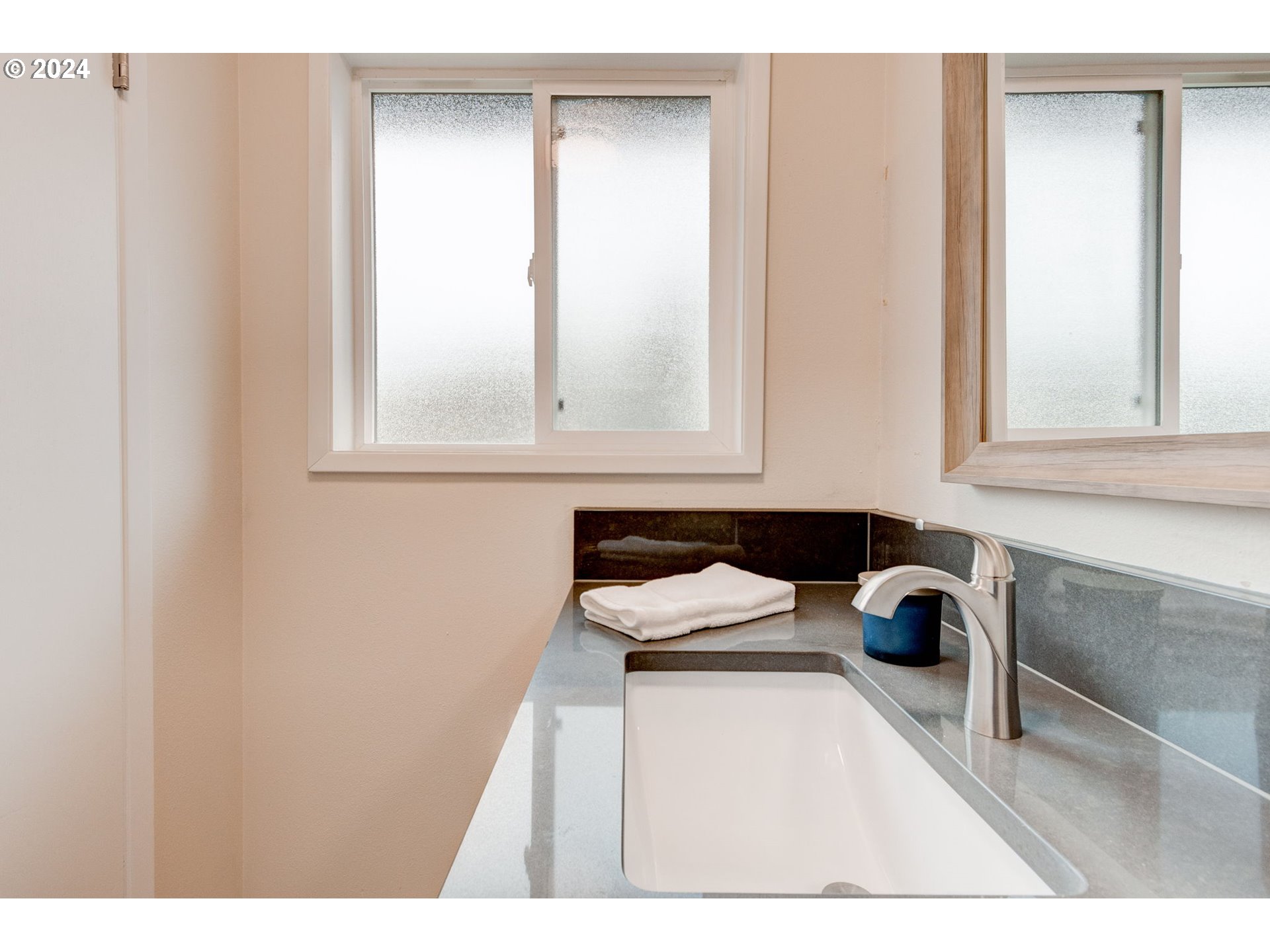 8815 Southwest 69th Avenue Portland, OR 97223 - Photo 26 of 36 a kitchen with a sink and cabinets