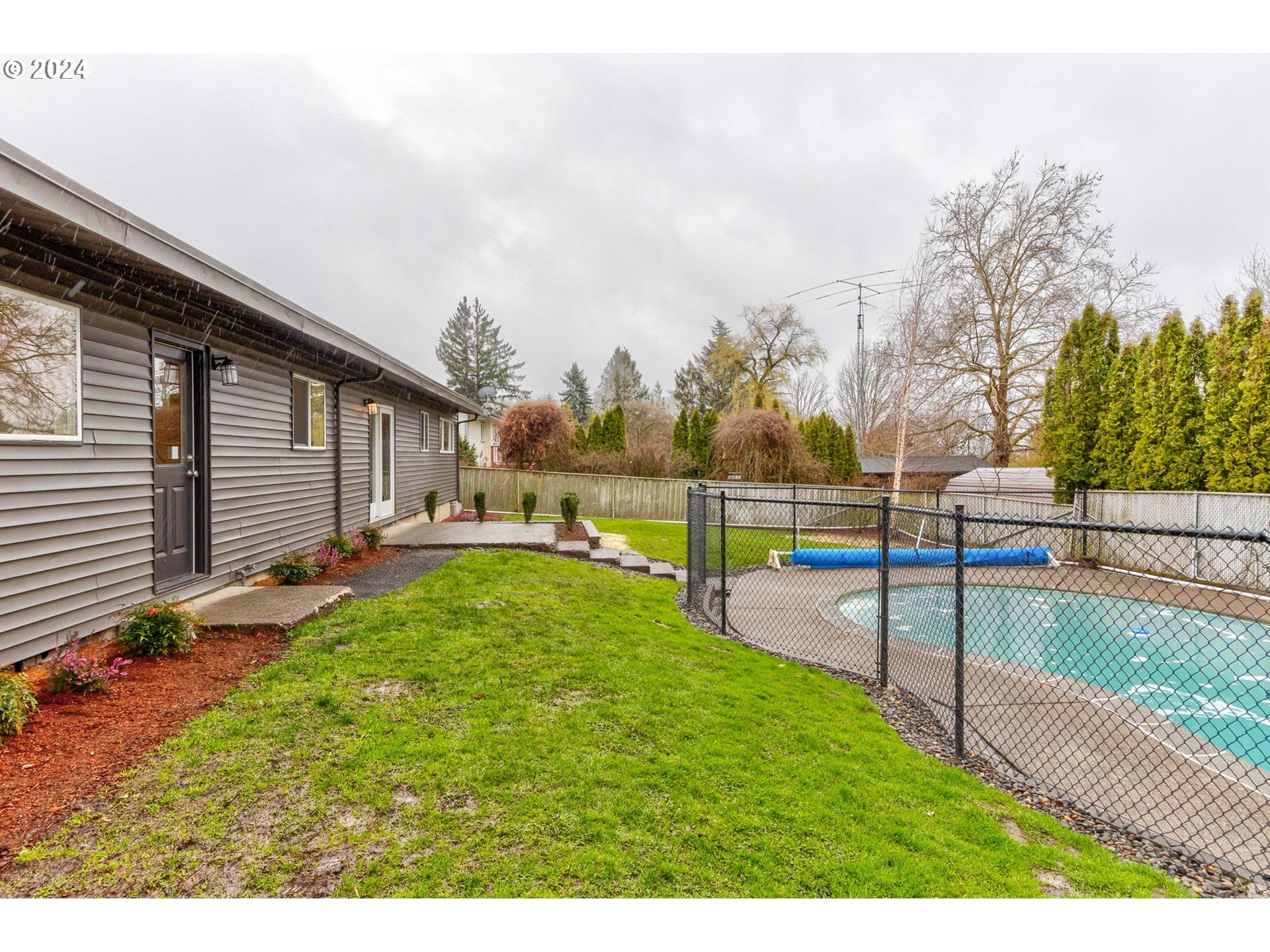 8815 Southwest 69th Avenue Portland, OR 97223 - Photo 28 of 36 a view of a backyard with trampoline