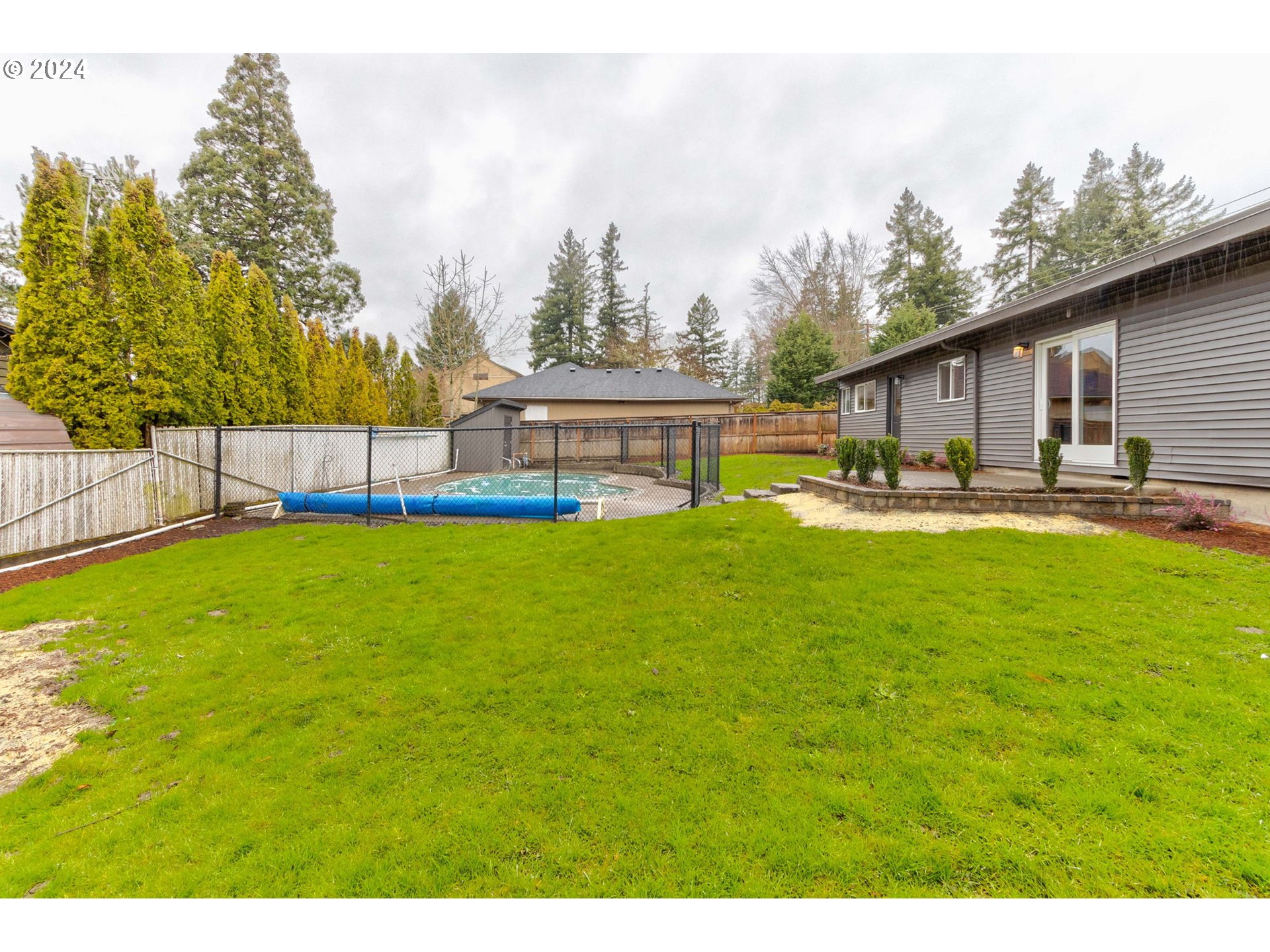 8815 Southwest 69th Avenue Portland, OR 97223 - Photo 30 of 36 a house view with swimming pool and sitting space