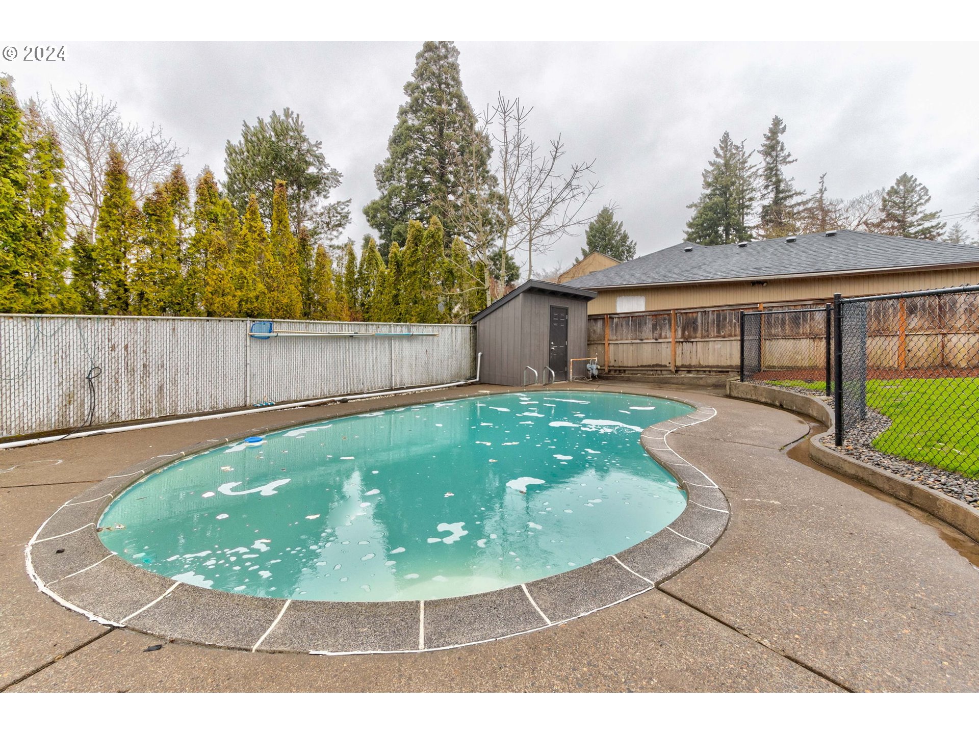 8815 Southwest 69th Avenue Portland, OR 97223 - Photo 32 of 36 a view of a backyard with a swimming pool