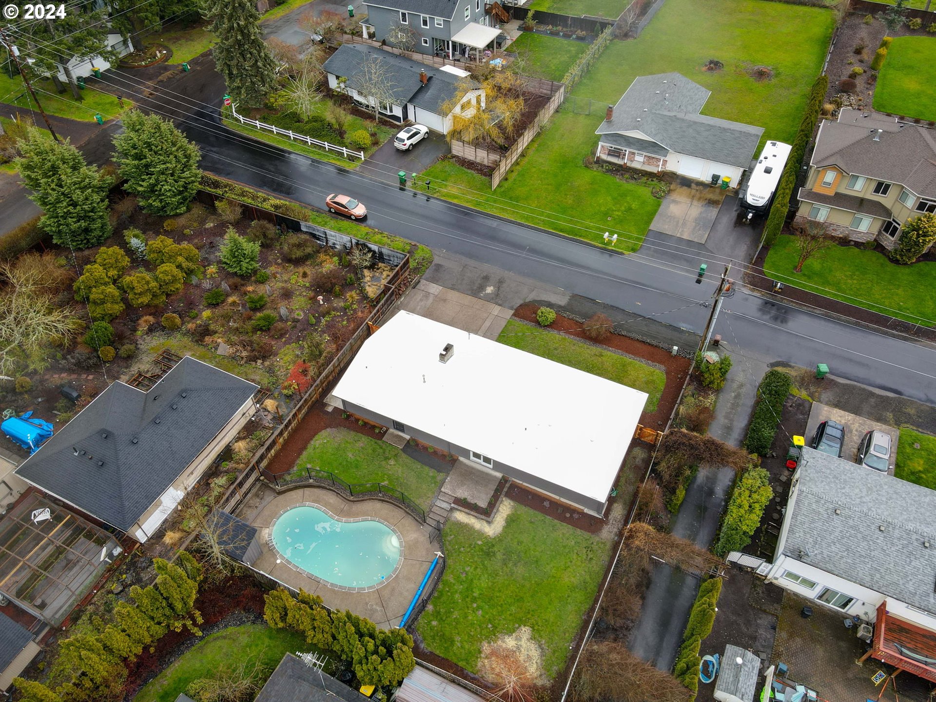8815 Southwest 69th Avenue Portland, OR 97223 - Photo 35 of 36 an aerial view of a house with a yard and pool