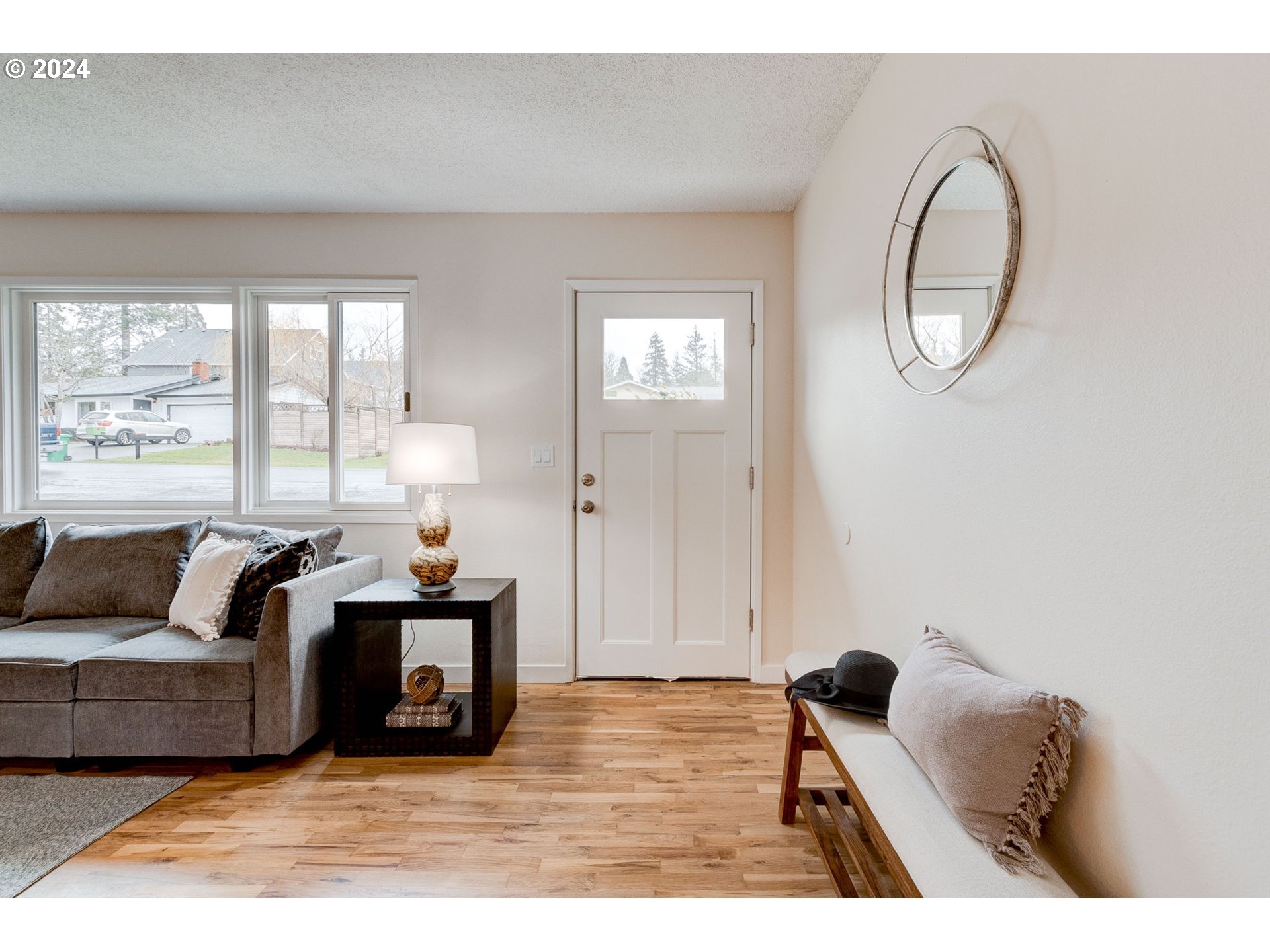 8815 Southwest 69th Avenue Portland, OR 97223 - Photo 5 of 36 a living room with furniture and a large window