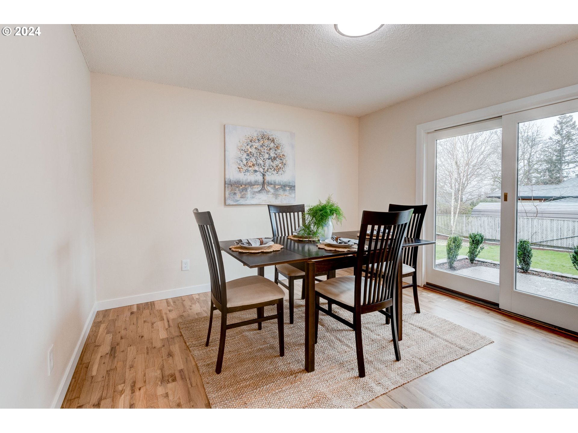 8815 Southwest 69th Avenue Portland, OR 97223 - Photo 7 of 36 a dining room with furniture and wooden floor