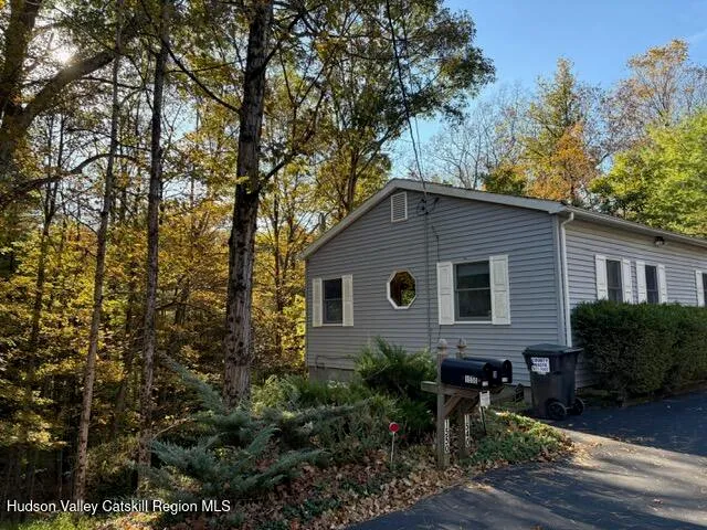 a backyard of a house with wooden floor yard and outdoor seating