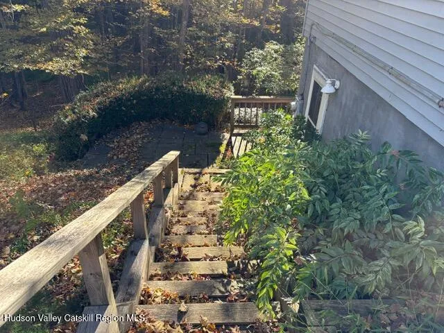 a view of balcony with wooden floor and fence
