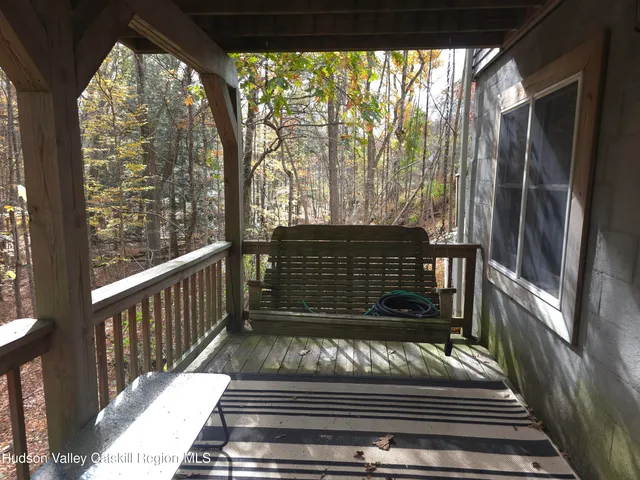 a view of balcony with wooden floor