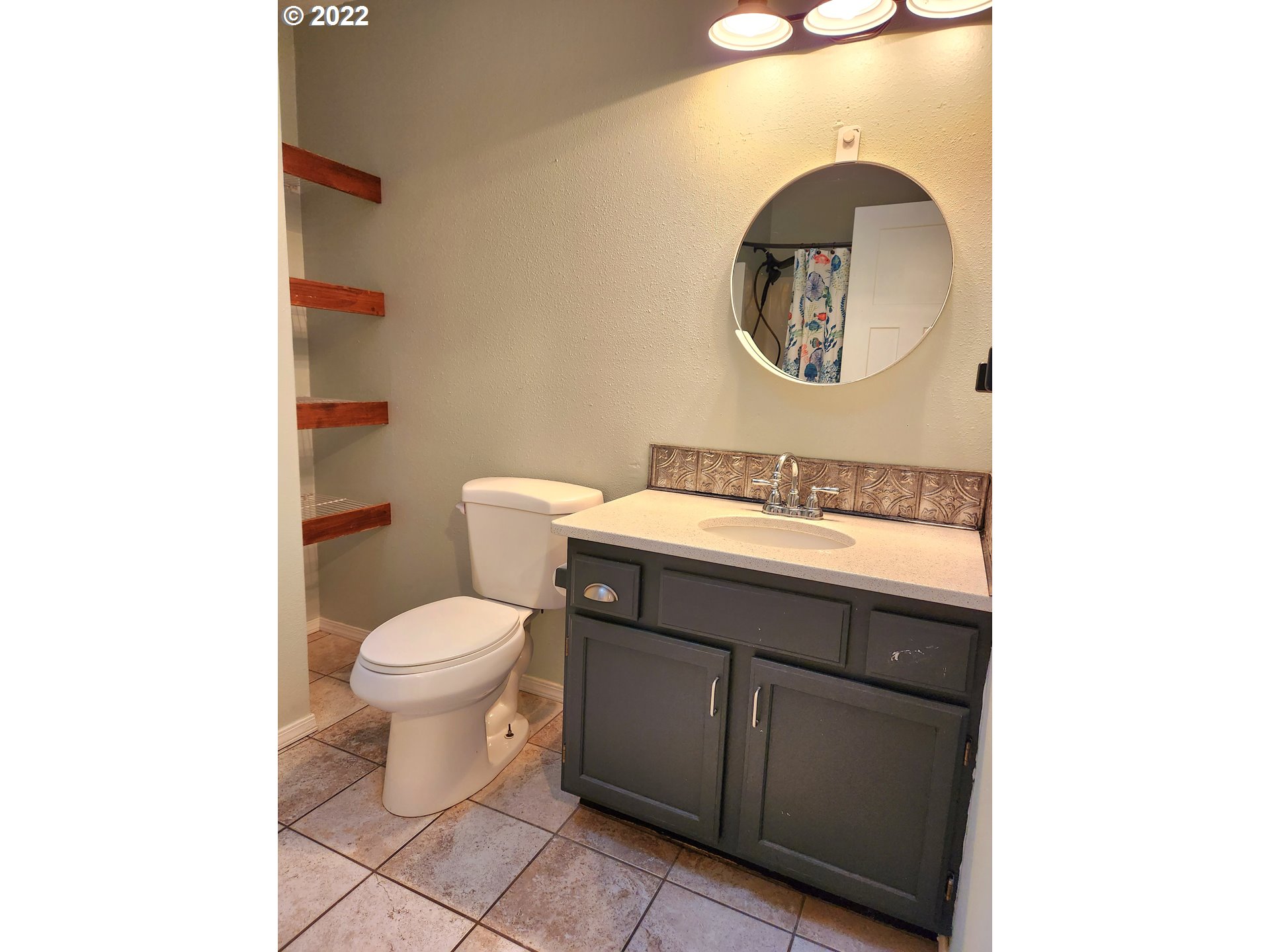 3785 Southwest Marshall Place Pendleton, OR 97801 - Photo 11 of 20 a bathroom with a toilet a sink and a mirror