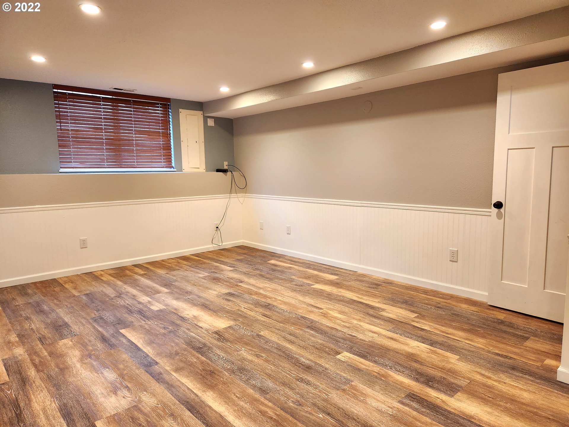 3785 Southwest Marshall Place Pendleton, OR 97801 - Photo 15 of 20 an empty room with wooden floor and windows