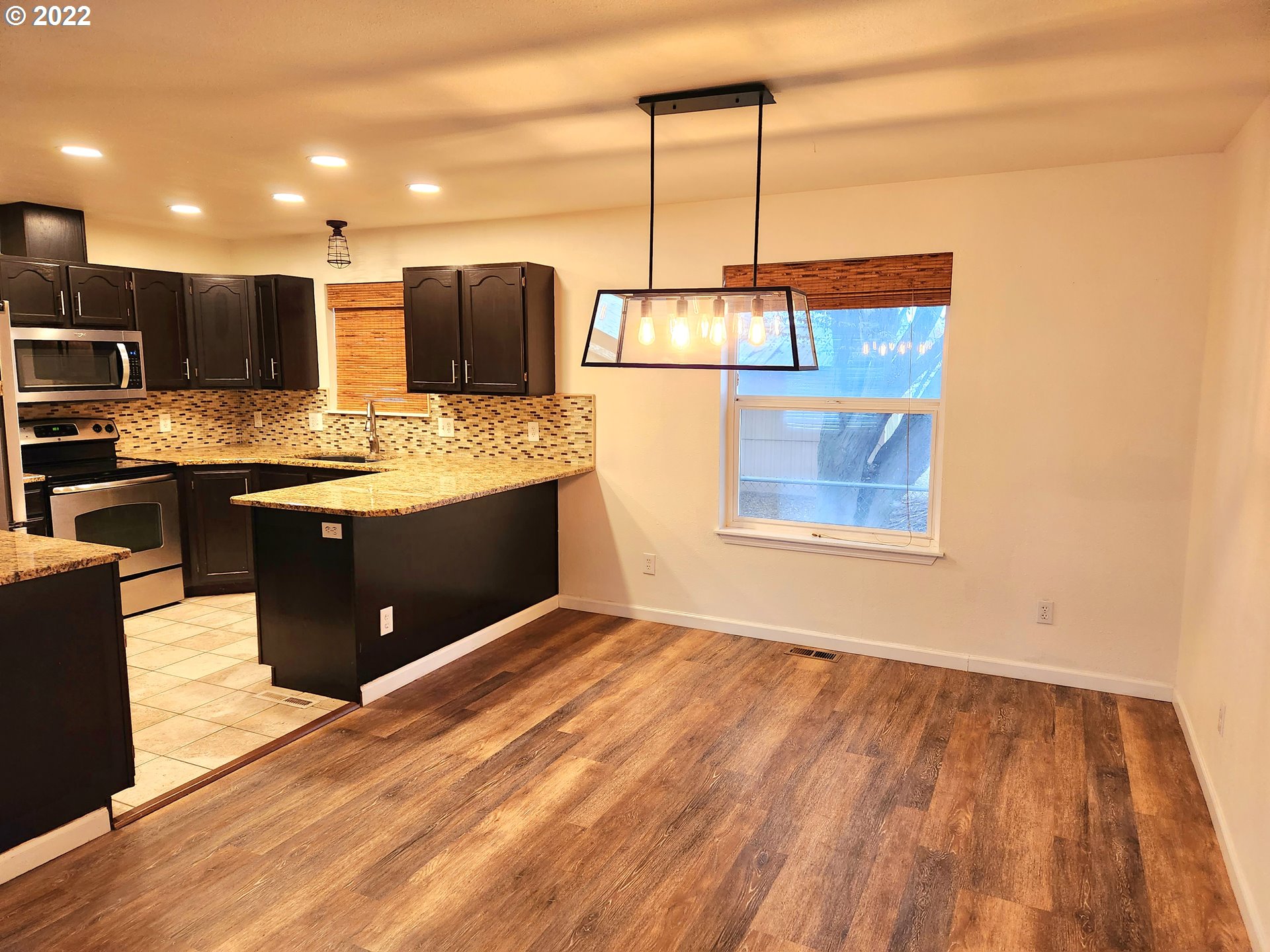 3785 Southwest Marshall Place Pendleton, OR 97801 - Photo 2 of 20 a view of kitchen with stainless steel appliances granite countertop a sink and cabinets