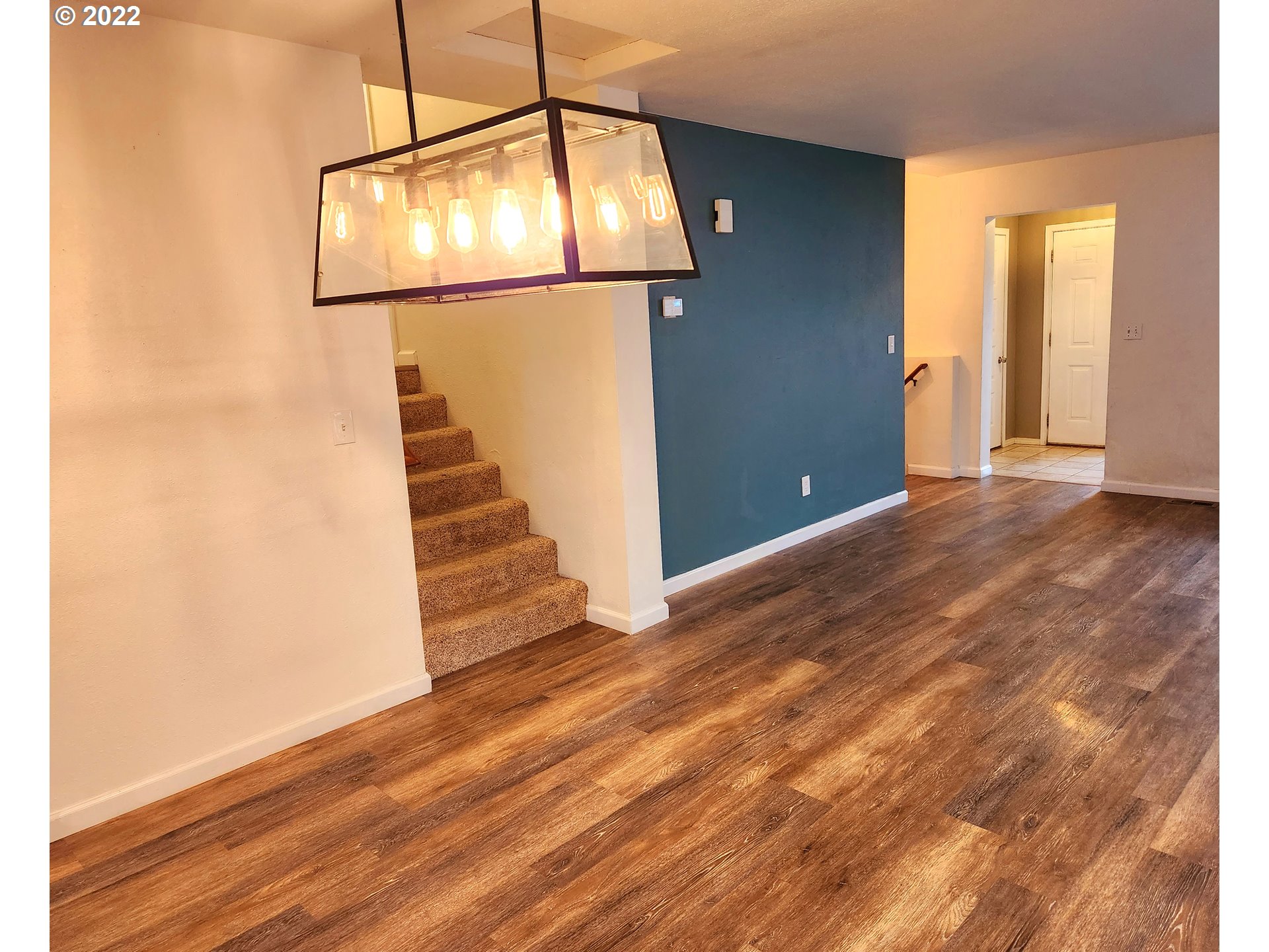 3785 Southwest Marshall Place Pendleton, OR 97801 - Photo 6 of 20 a view of a livingroom with wooden floor and staircase