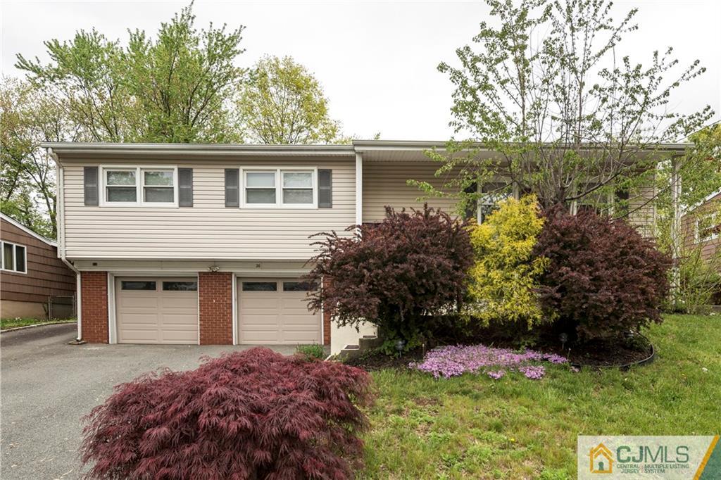 26 Peake Road Edison, NJ 08837 - Photo 1 of 23 a view of a house with a yard and potted plants
