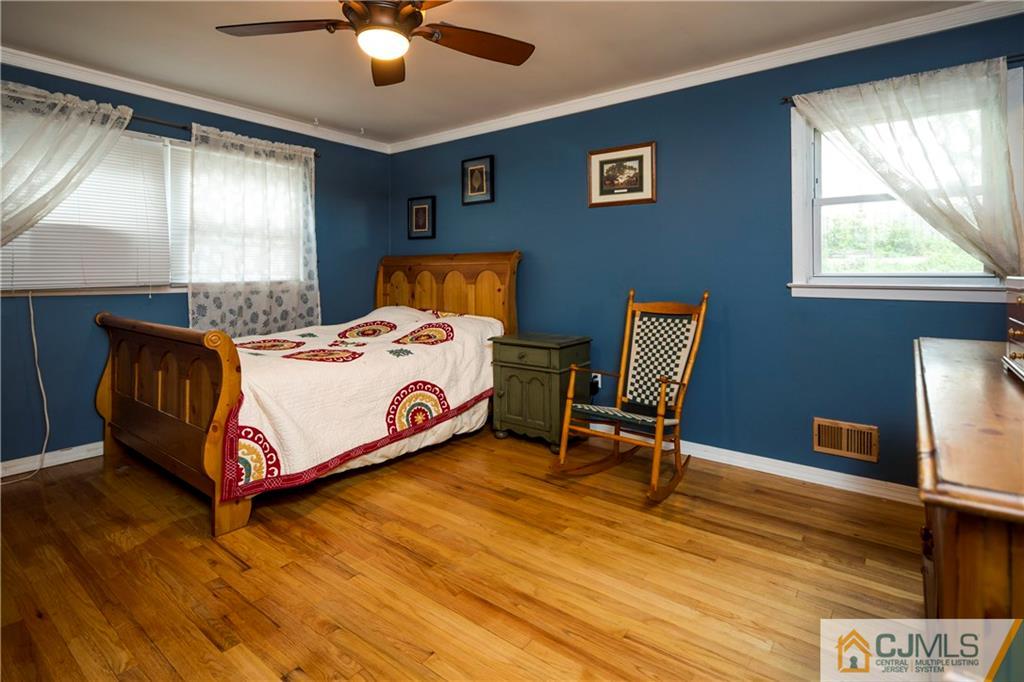 26 Peake Road Edison, NJ 08837 - Photo 15 of 23 a bedroom with a bed and window