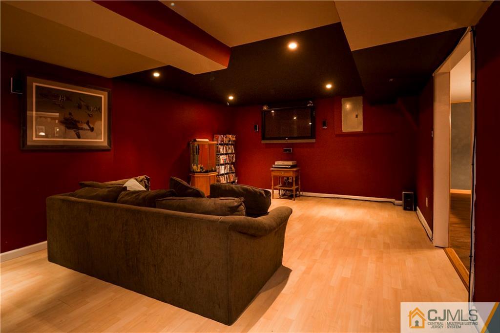 26 Peake Road Edison, NJ 08837 - Photo 18 of 23 a living room with furniture and a flat screen tv