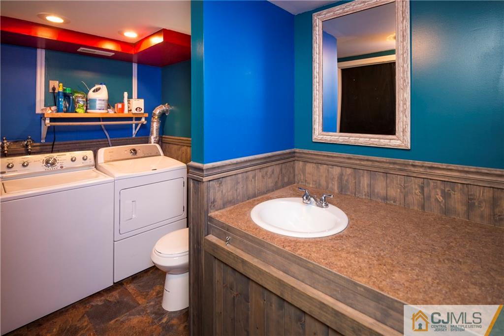 26 Peake Road Edison, NJ 08837 - Photo 20 of 23 a bathroom with a sink and a mirror