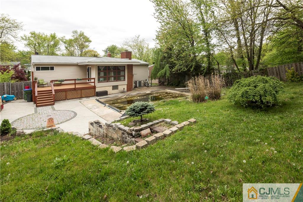 26 Peake Road Edison, NJ 08837 - Photo 22 of 23 a view of a house with backyard sitting area and garden