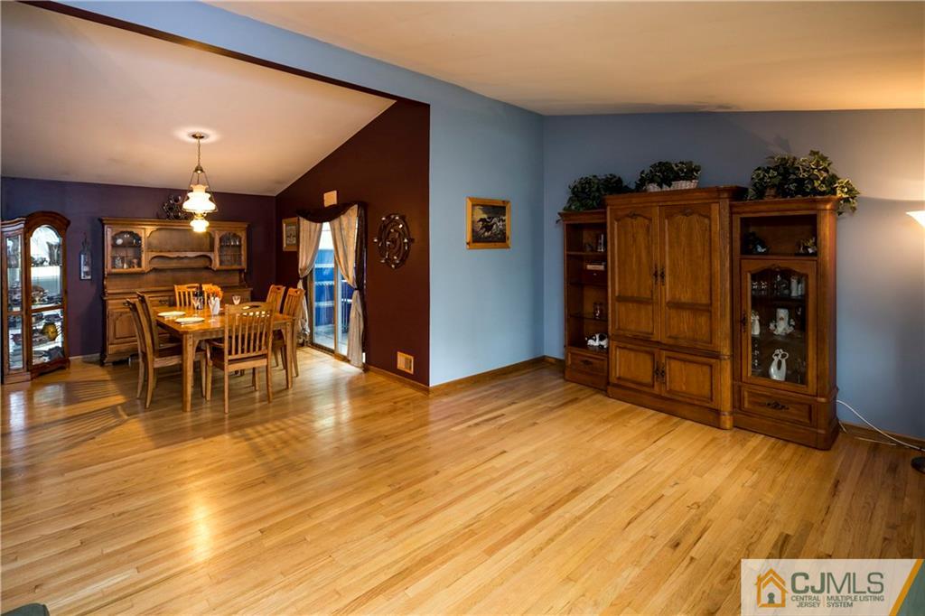 26 Peake Road Edison, NJ 08837 - Photo 7 of 23 a view of a livingroom with furniture and wooden floor