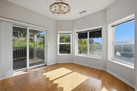 a bathroom with bathtub and window
